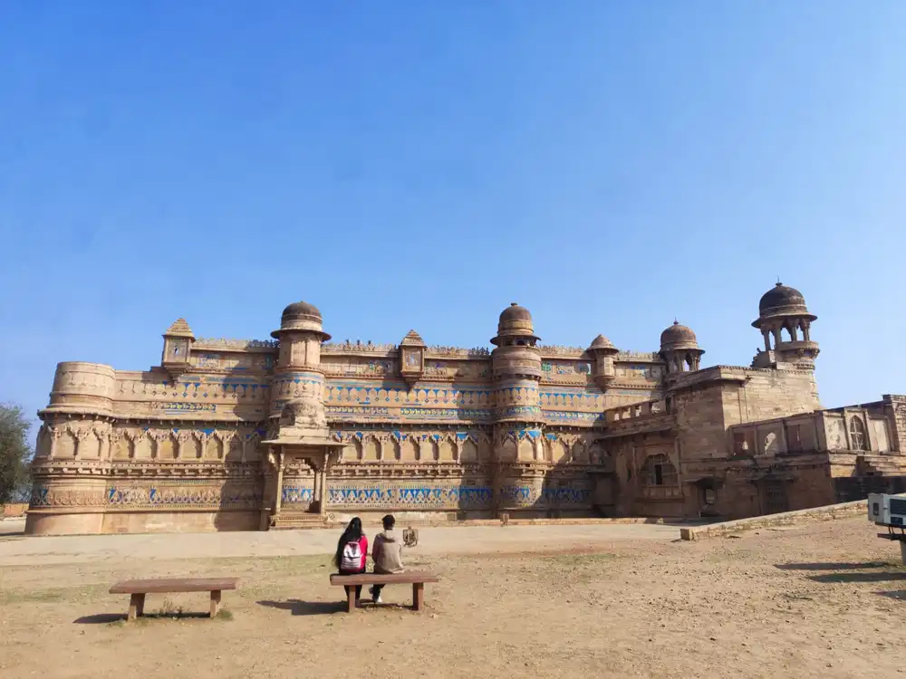 A striking view of Gwalior Fort with its blue-tiled palace and ancient ramparts.