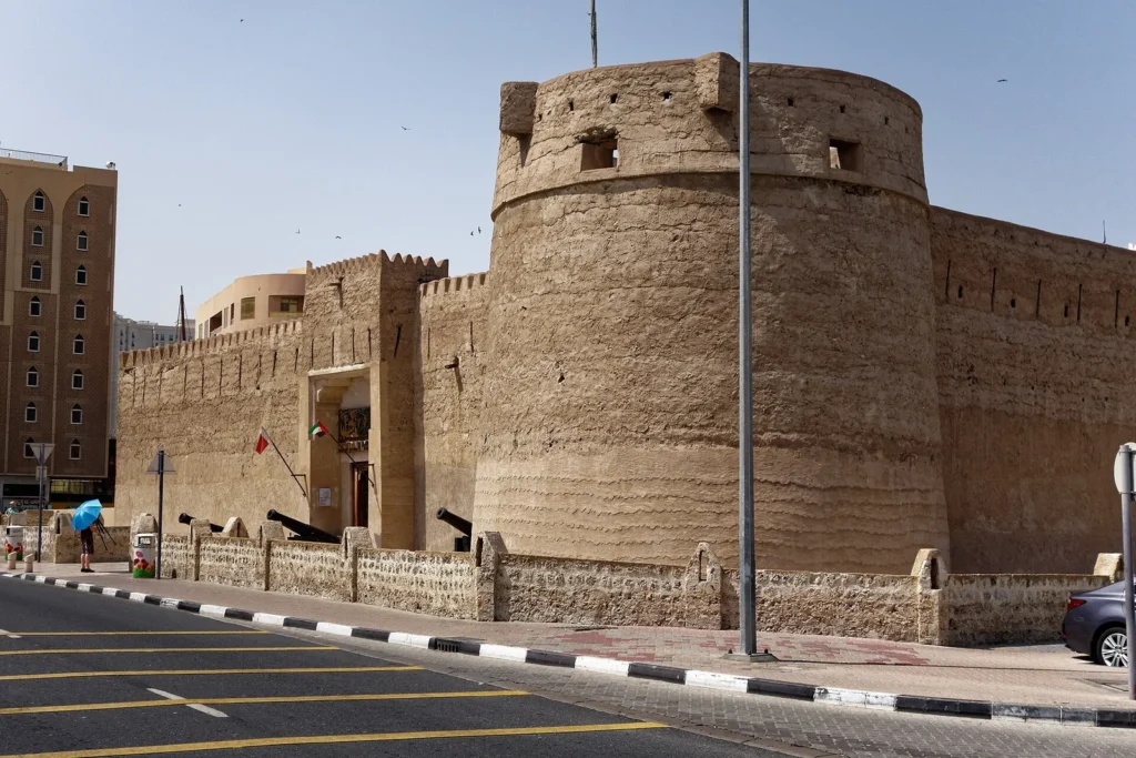The sand-coloured walls and tower of Al Fahidi Fort in Dubai