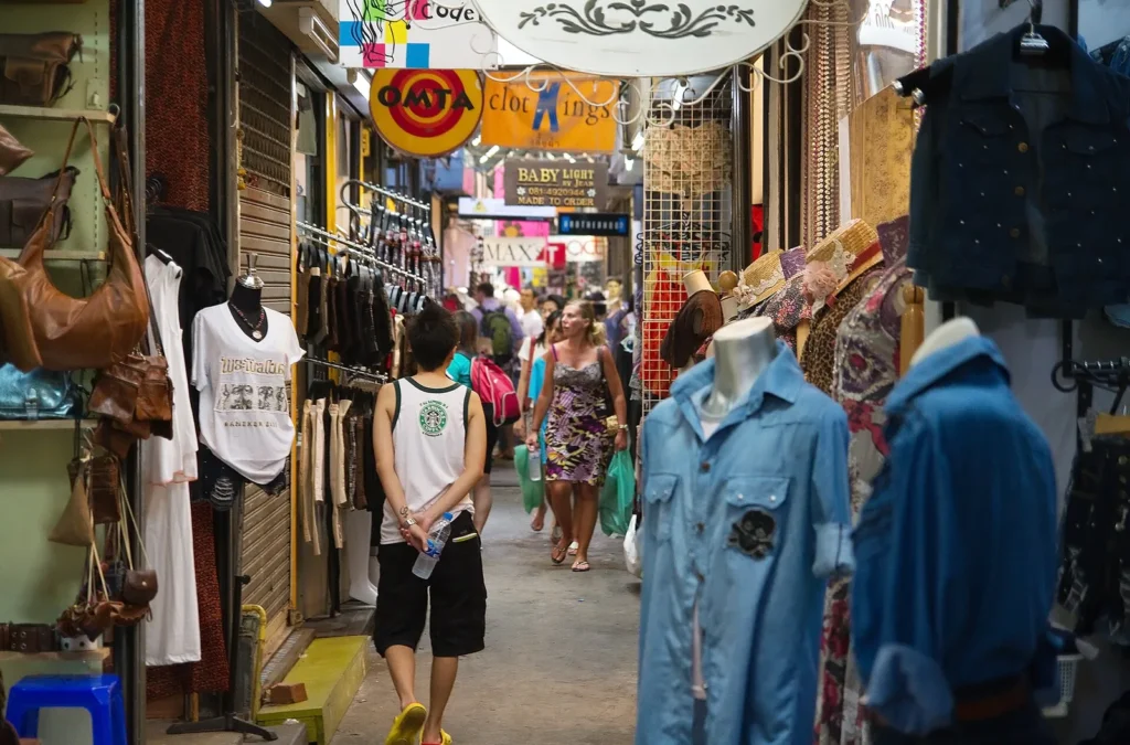 A narrow covered lane of stalls at Chatuchak Weekend Market in Bangkok