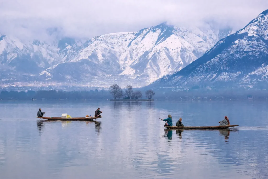 Dal Lake near Hazratbal in Srinagar with snow covered mountains behind