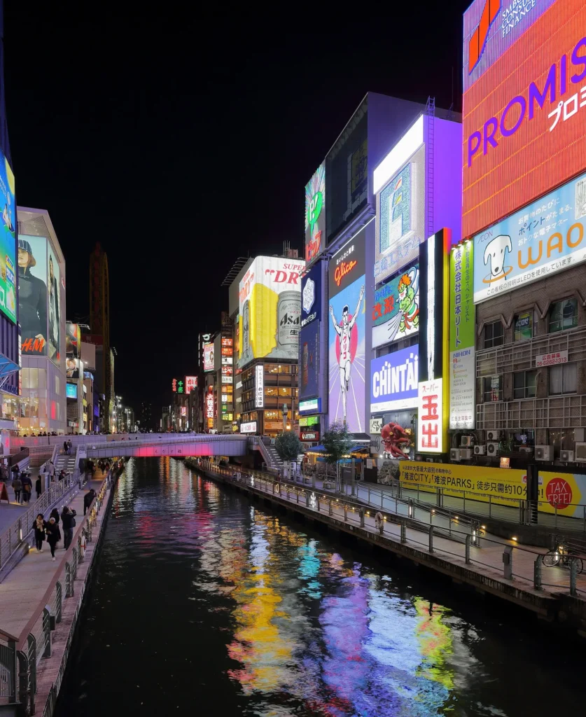 Neon signboards along the Dotonbori canal in Osaka at night