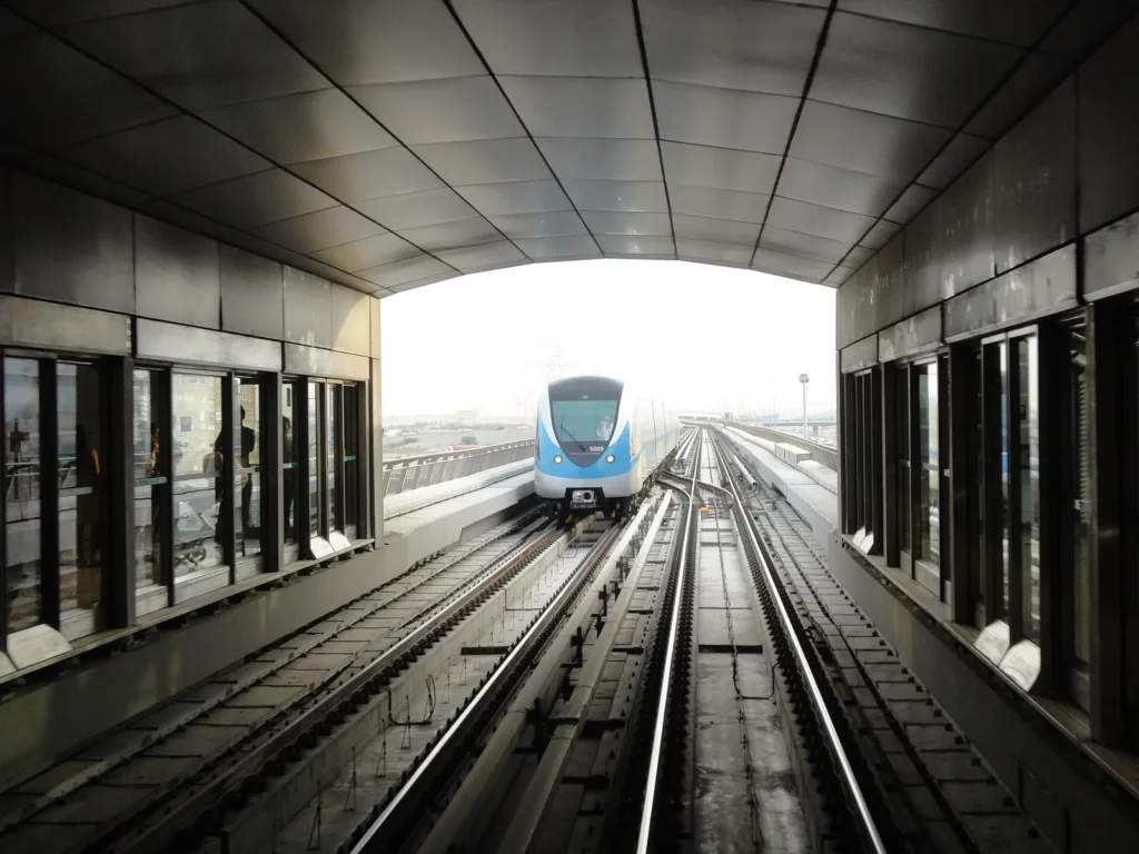 A Dubai Metro train at an elevated station