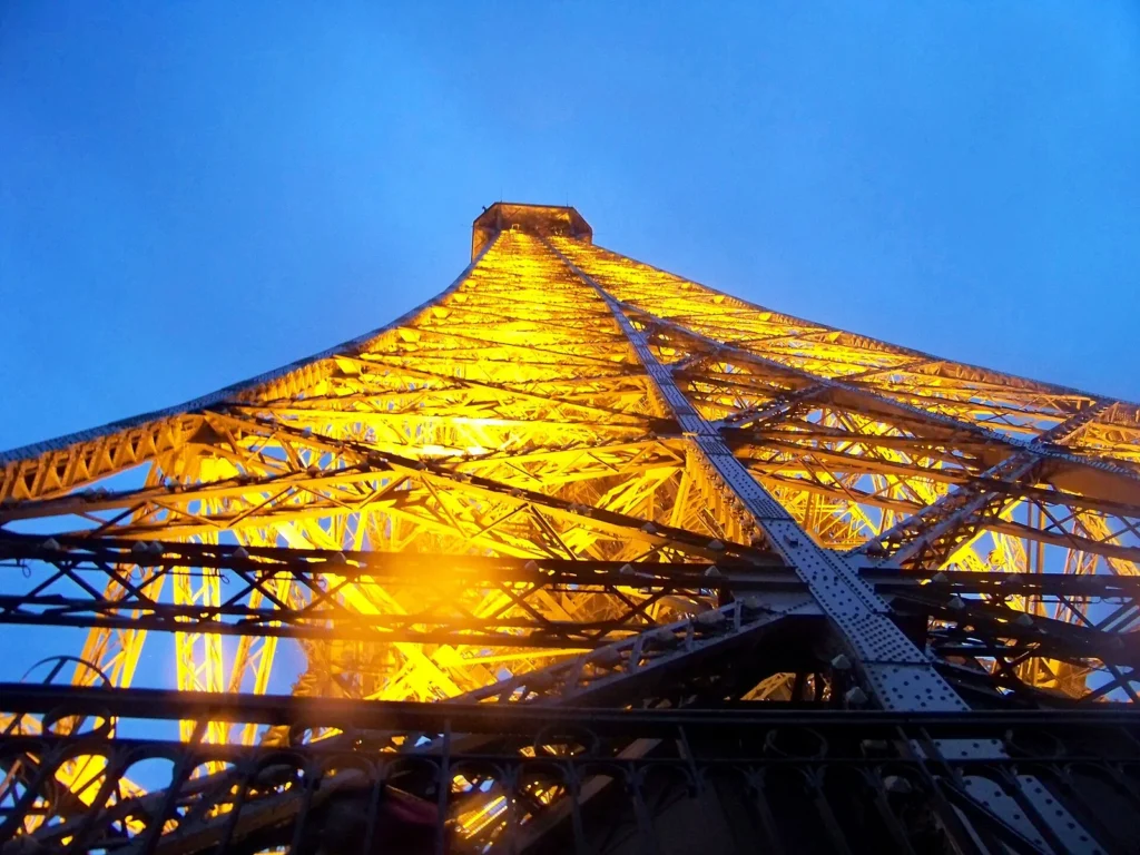 The upper section of the Eiffel Tower seen from the second floor platform