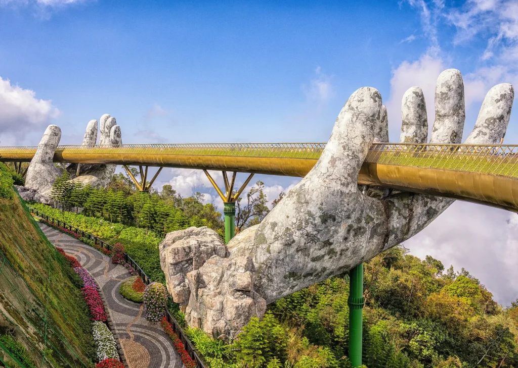 The Golden Bridge at Ba Na Hills held up by two giant stone hands