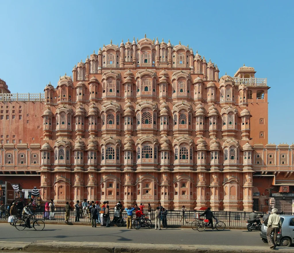 The pink sandstone facade of the Hawa Mahal in Jaipur with its many small windows
