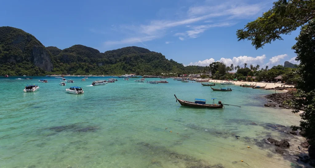 A white sand beach and green hills on Ko Phi Phi Don