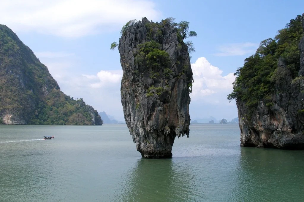 The narrow limestone pillar of Ko Tapu rising out of the sea in Phang Nga Bay