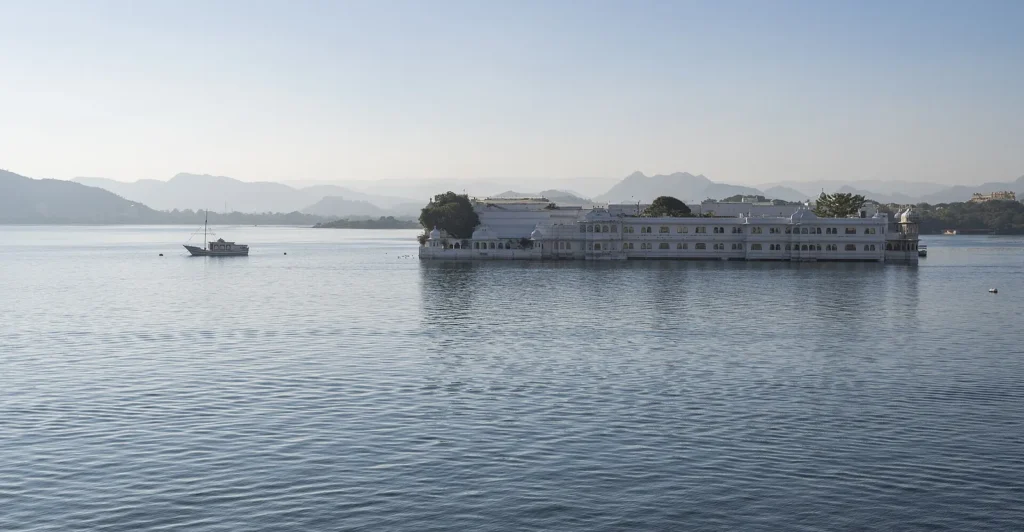 The white Lake Palace on its island in Lake Pichola seen from the City Palace