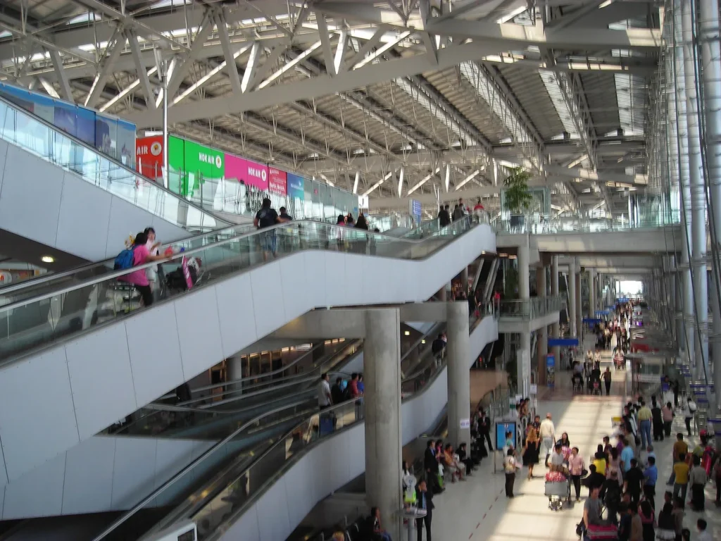 Escalators and the steel and glass roof inside the main terminal of Suvarnabhumi Airport