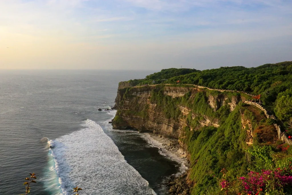Green-topped limestone cliff dropping into the ocean at Uluwatu in south Bali