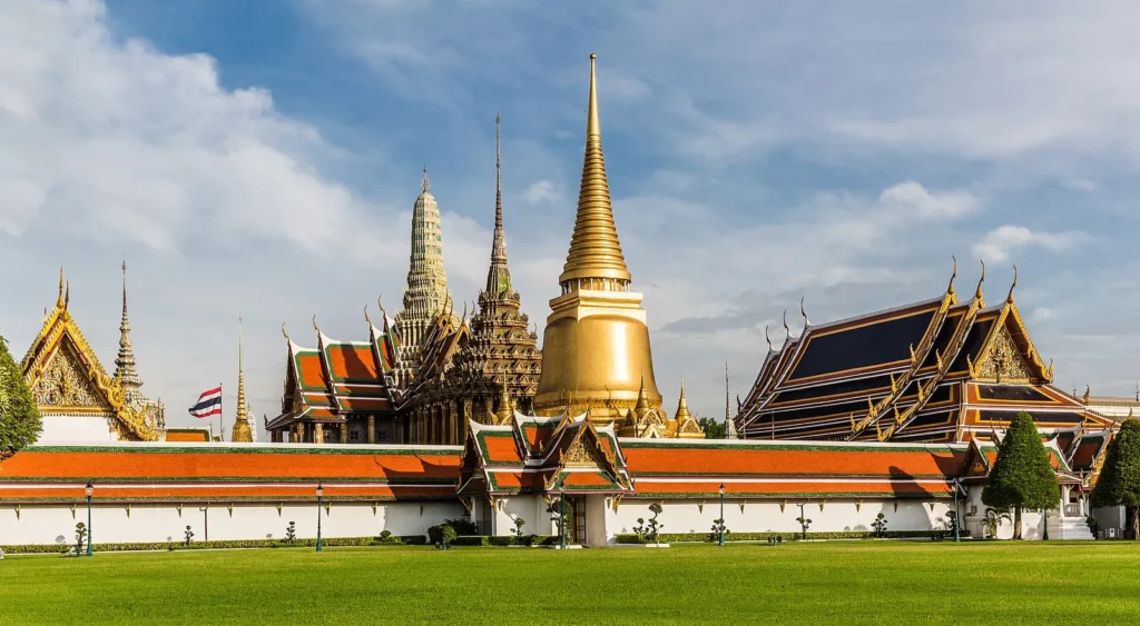 A golden chedi on a lawn inside Wat Phra Kaew in Bangkok